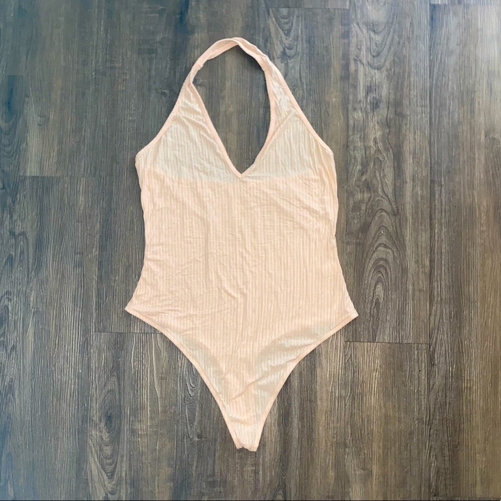 Me to We cream colored bodysuit